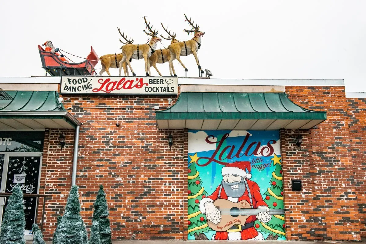 Santa and reindeer top the brick exterior of Lala's Little Nugget