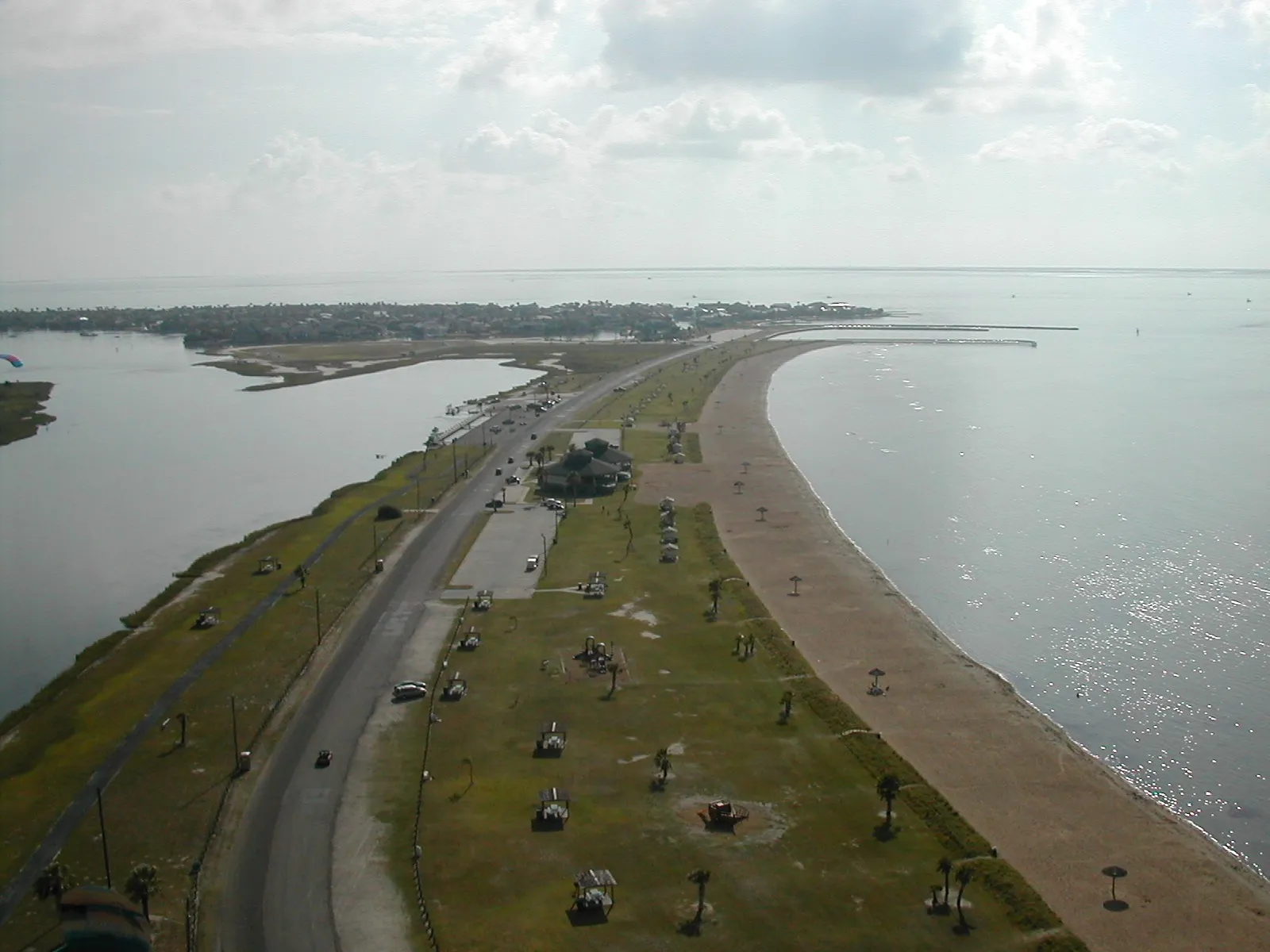 An aerial view of Rockport Beach curving along calm Aransas Bay