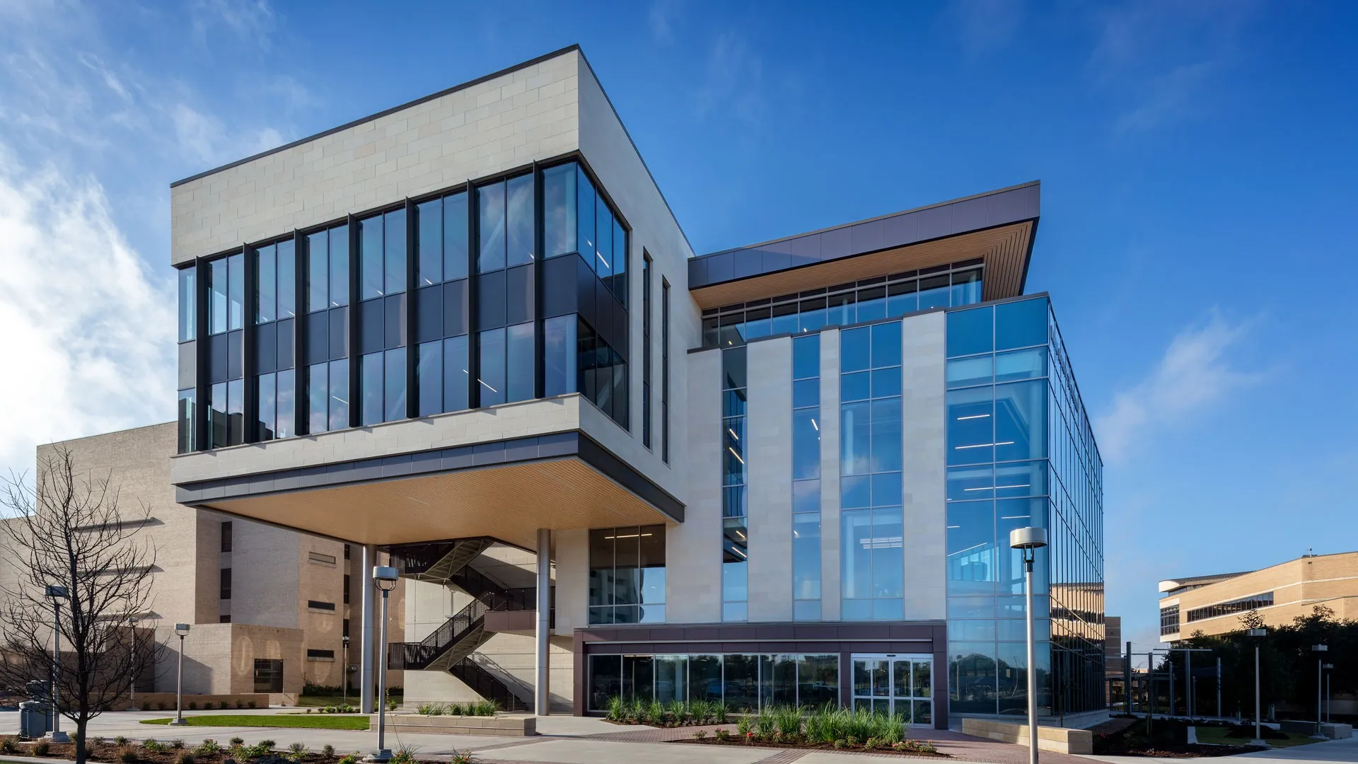 The limestone and glass exterior of the Wayne Roberts Building at Texas A&M