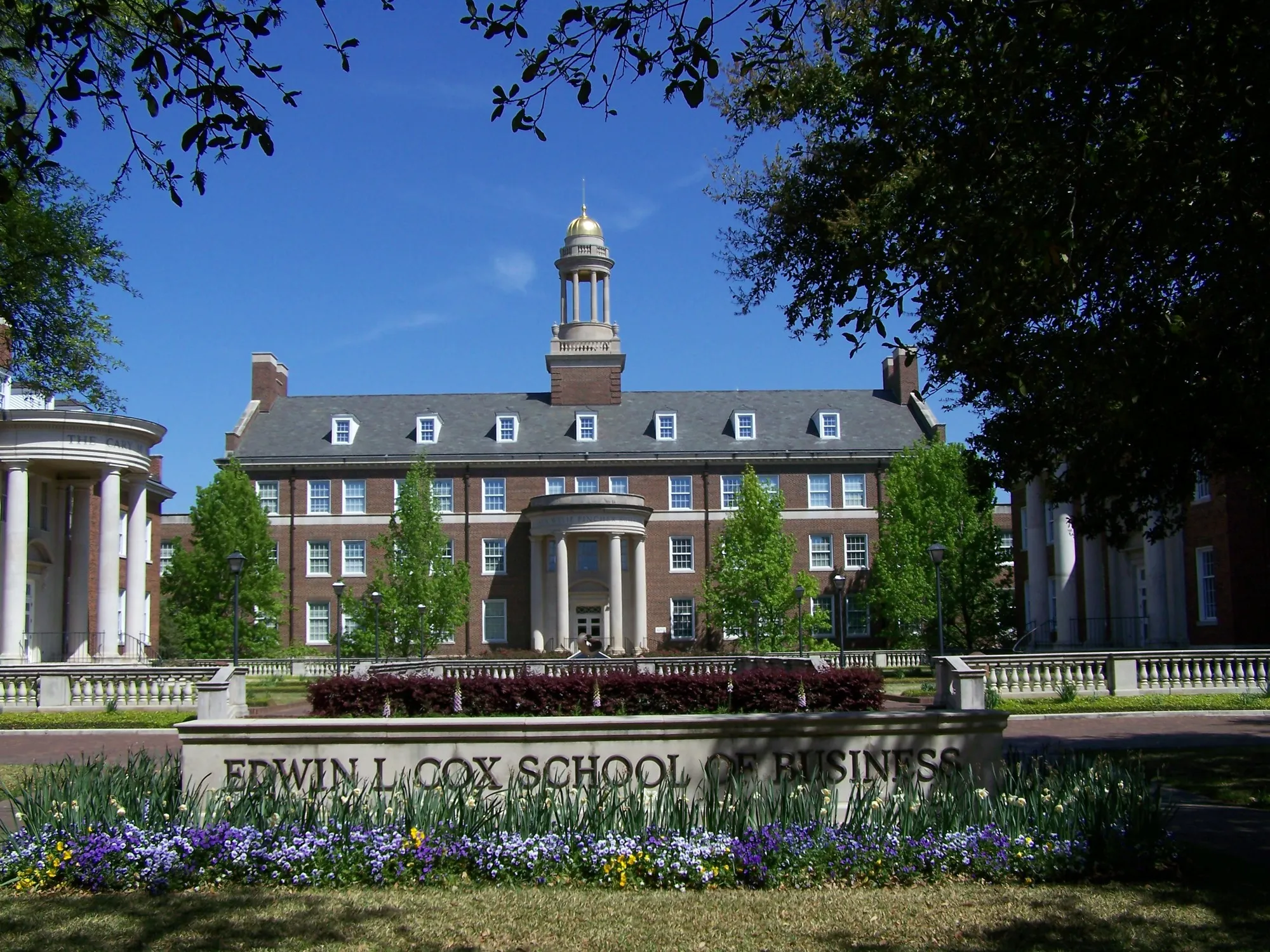 The red-brick Edwin L. Cox School of Business buildings and landscaped quad at SMU