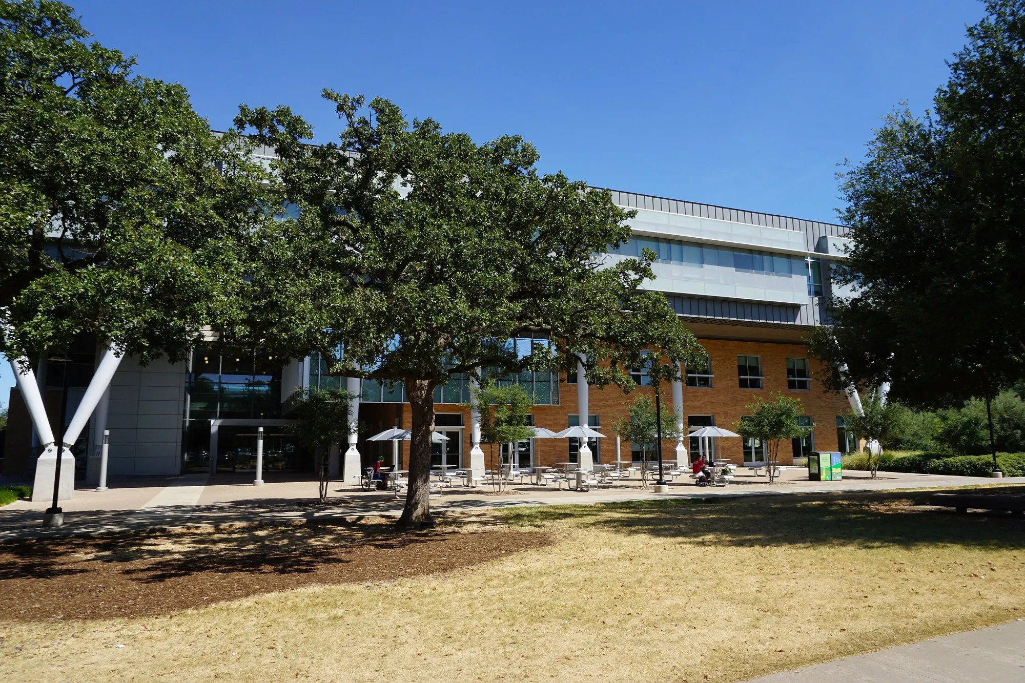 The glass, metal and brick Business Leadership Building at the University of North Texas