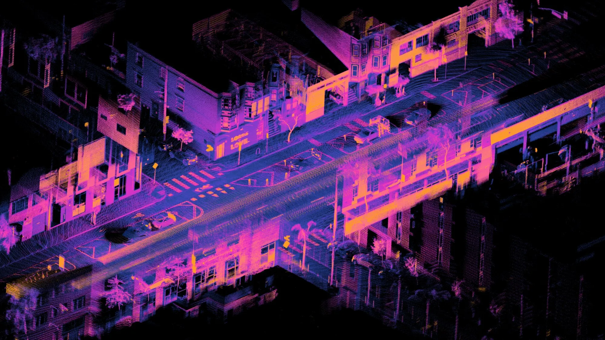 A colored LiDAR point cloud showing streets, buildings, trees and vehicles at an urban intersection
