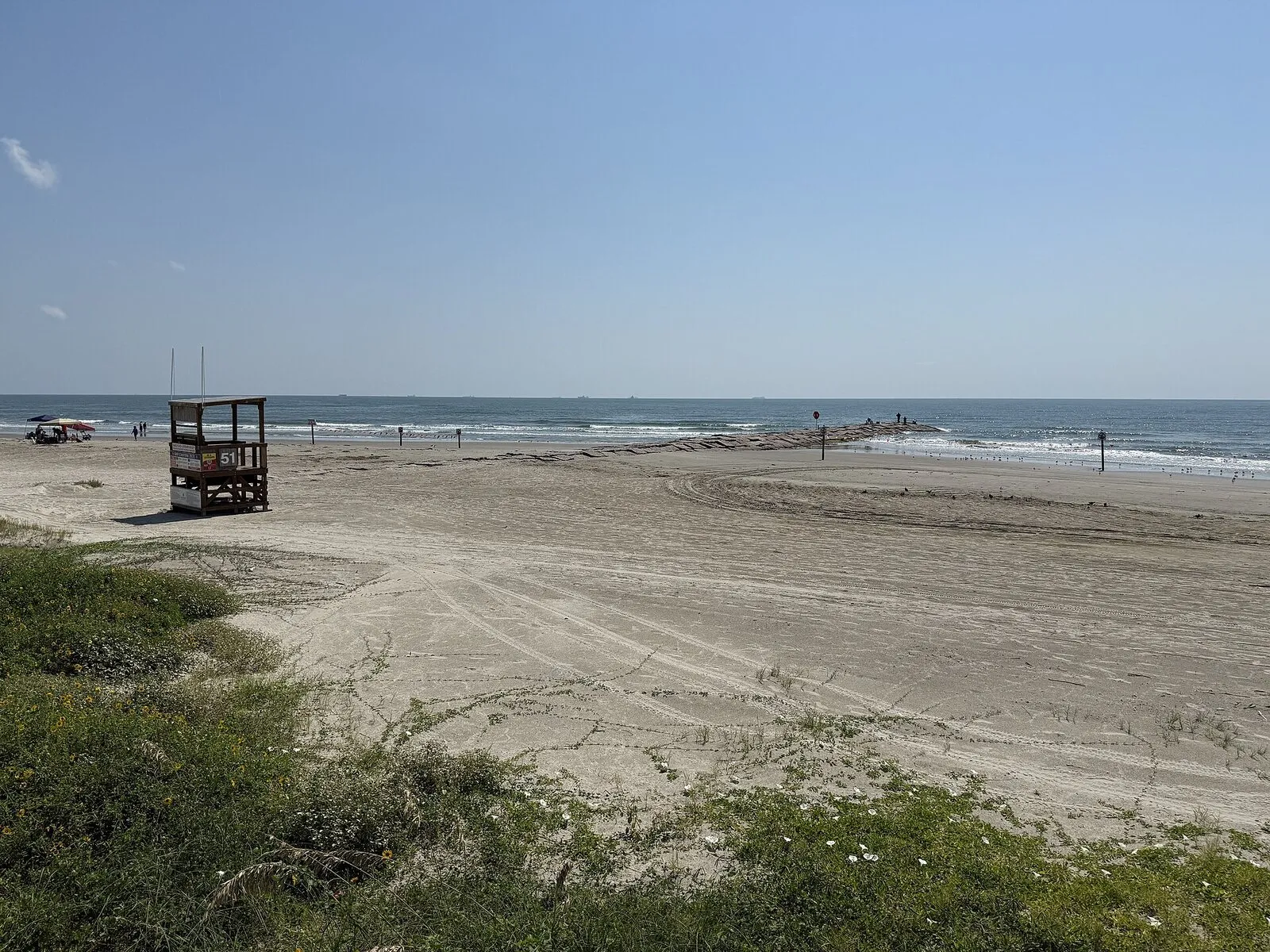 Sandy Galveston beach seen from the seawall