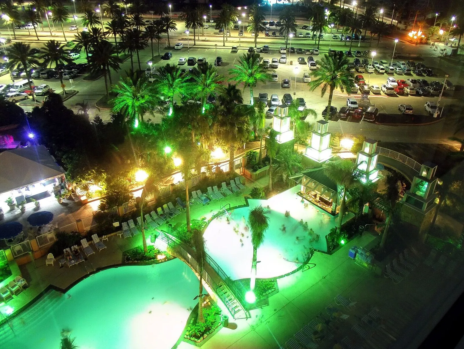 Moody Gardens Hotel pool lit at night in Galveston
