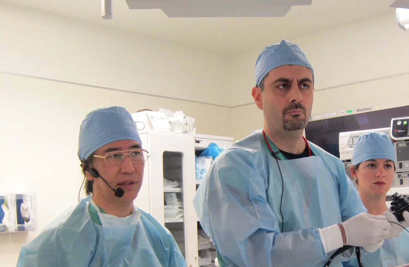 Two endoscopists perform a peroral endoscopic myotomy in a procedure room