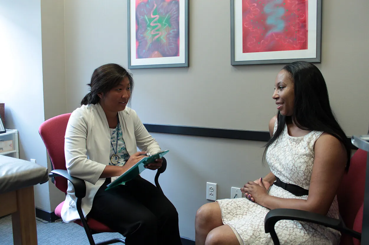 Two people talk during a medical nutrition therapy session