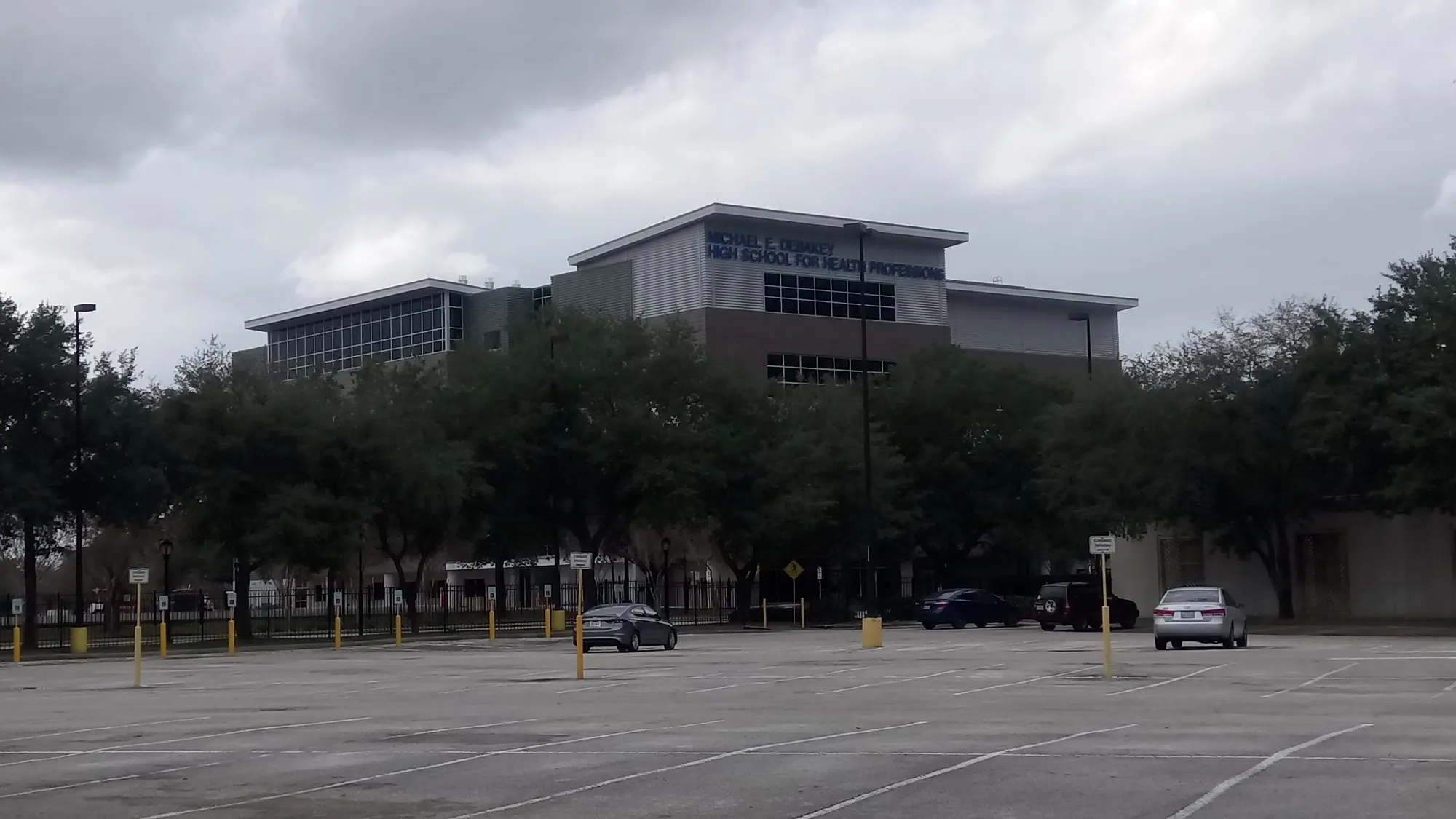 The glass and metal facade of DeBakey High School for Health Professions on Pressler Street