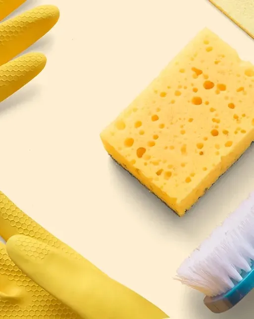 A gloved cleaner wiping a yellow sponge across a surface on Lollimaids' recurring-clean service page