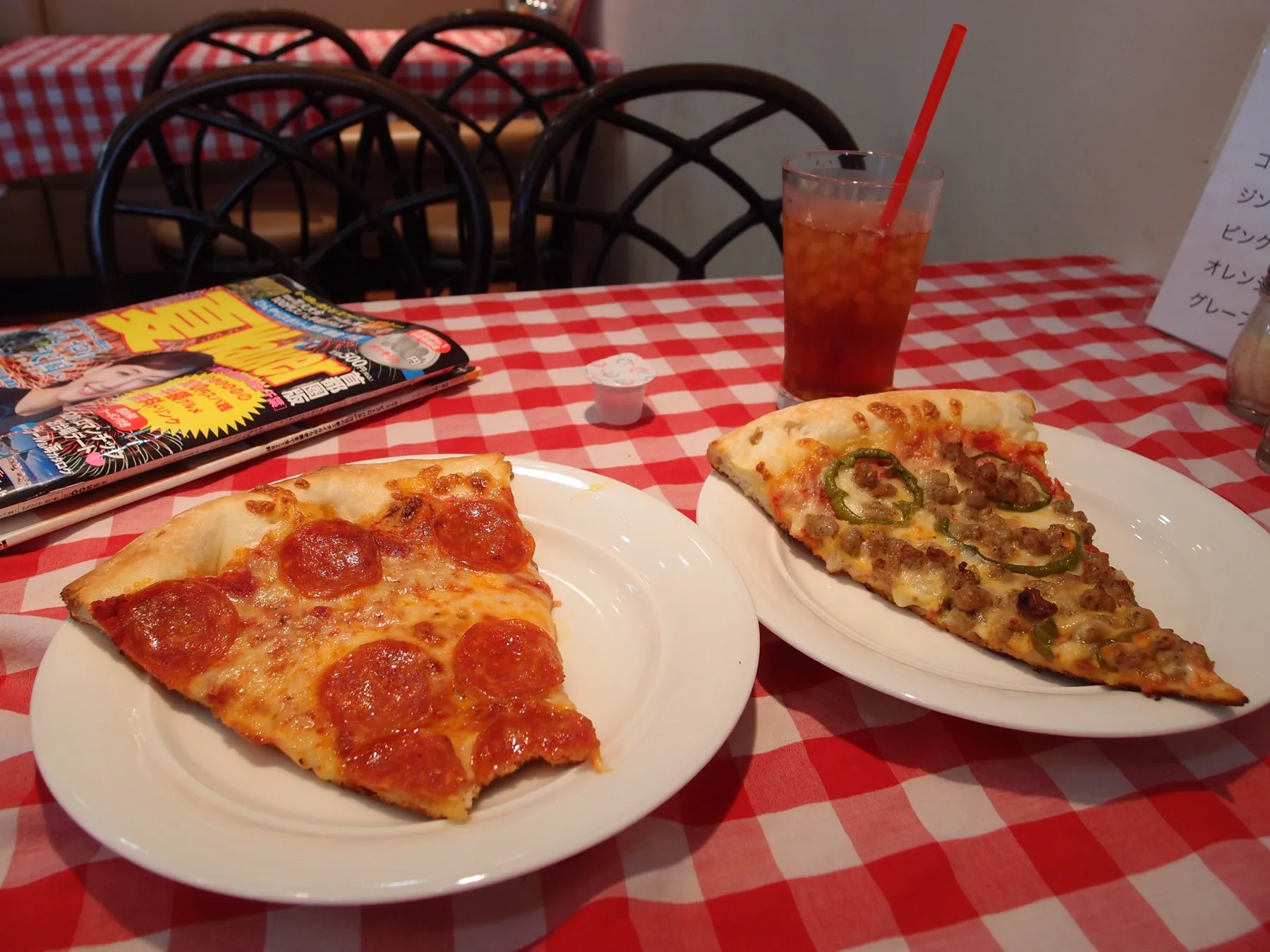 A wide New York-style pizza slice