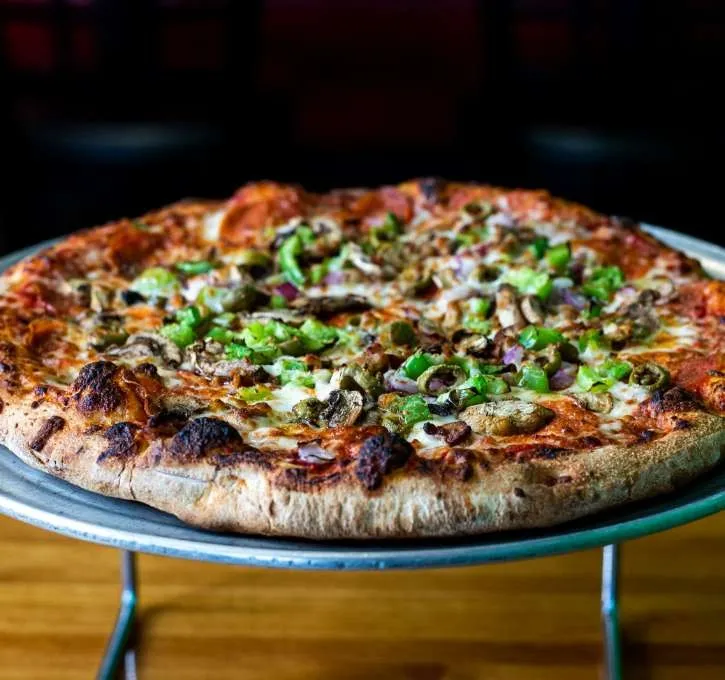 A Pizza Classics hand-tossed pizza topped with sausage, peppers, onions, mushrooms and olives