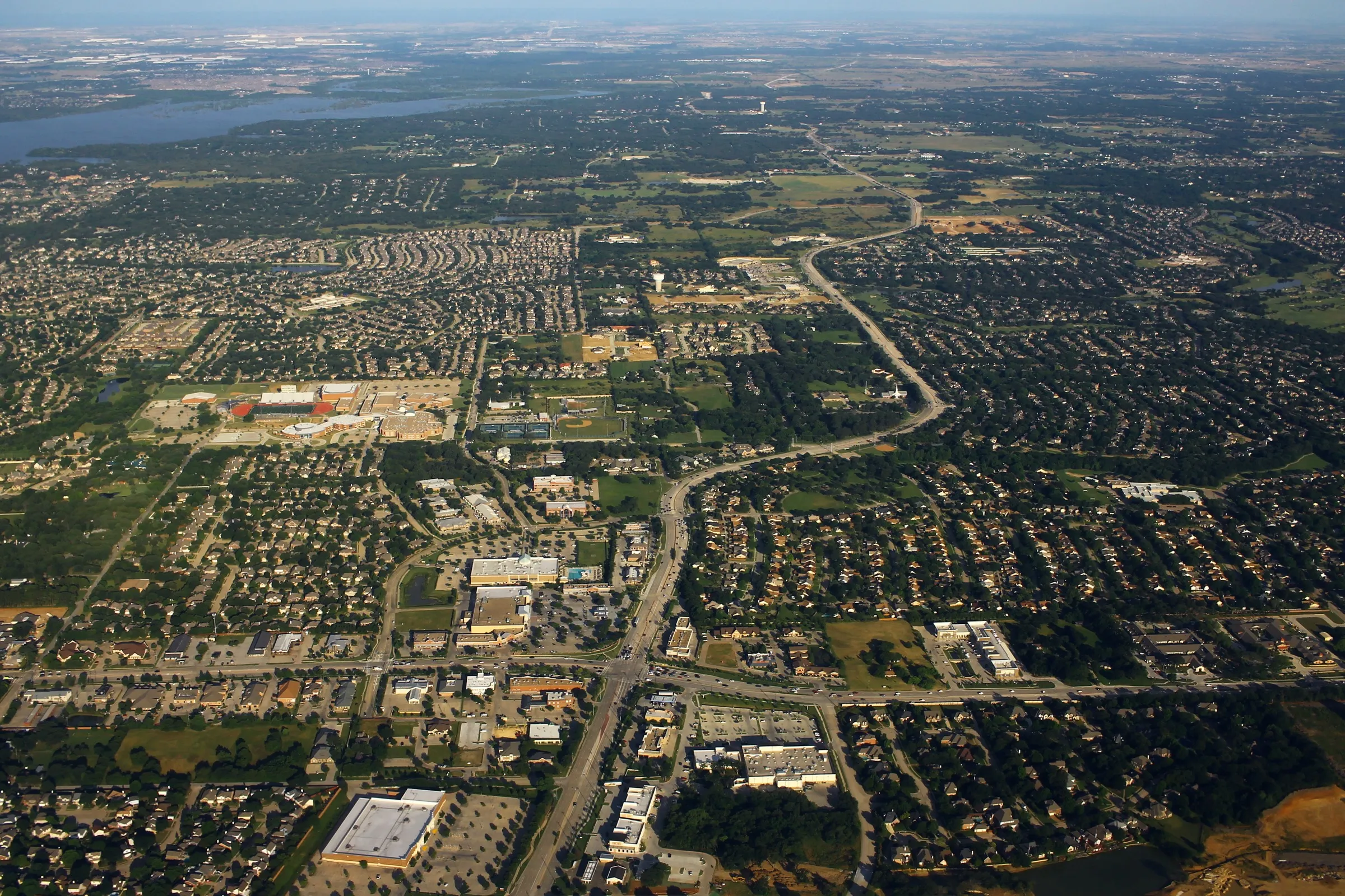An aerial view over the suburban streets, lakes and green space of Flower Mound, north-west of Dallas