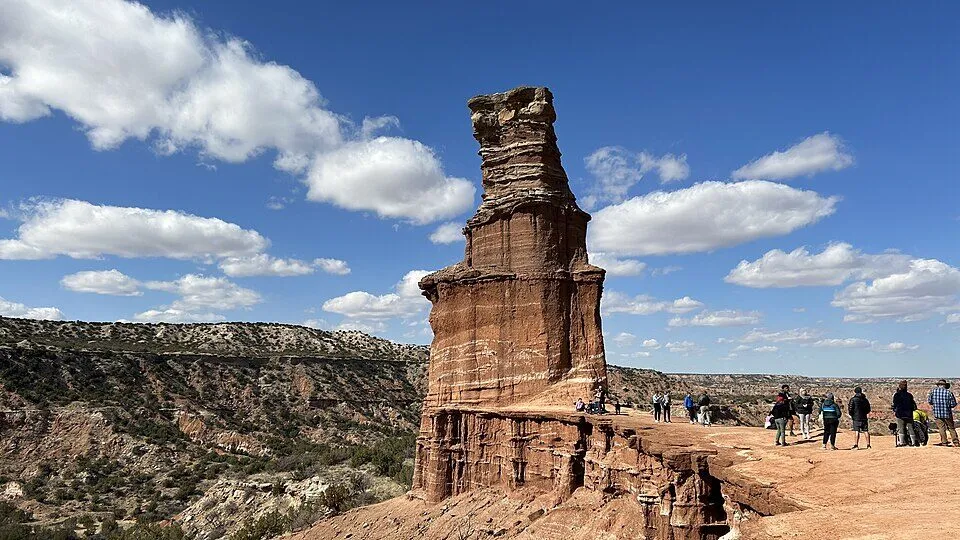 Visitors below the Lighthouse rock formation in Palo Duro Canyon State Park