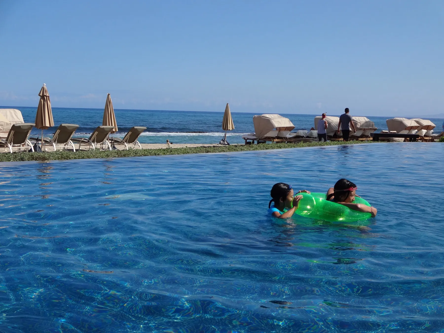 An infinity-edge swimming pool at a resort
