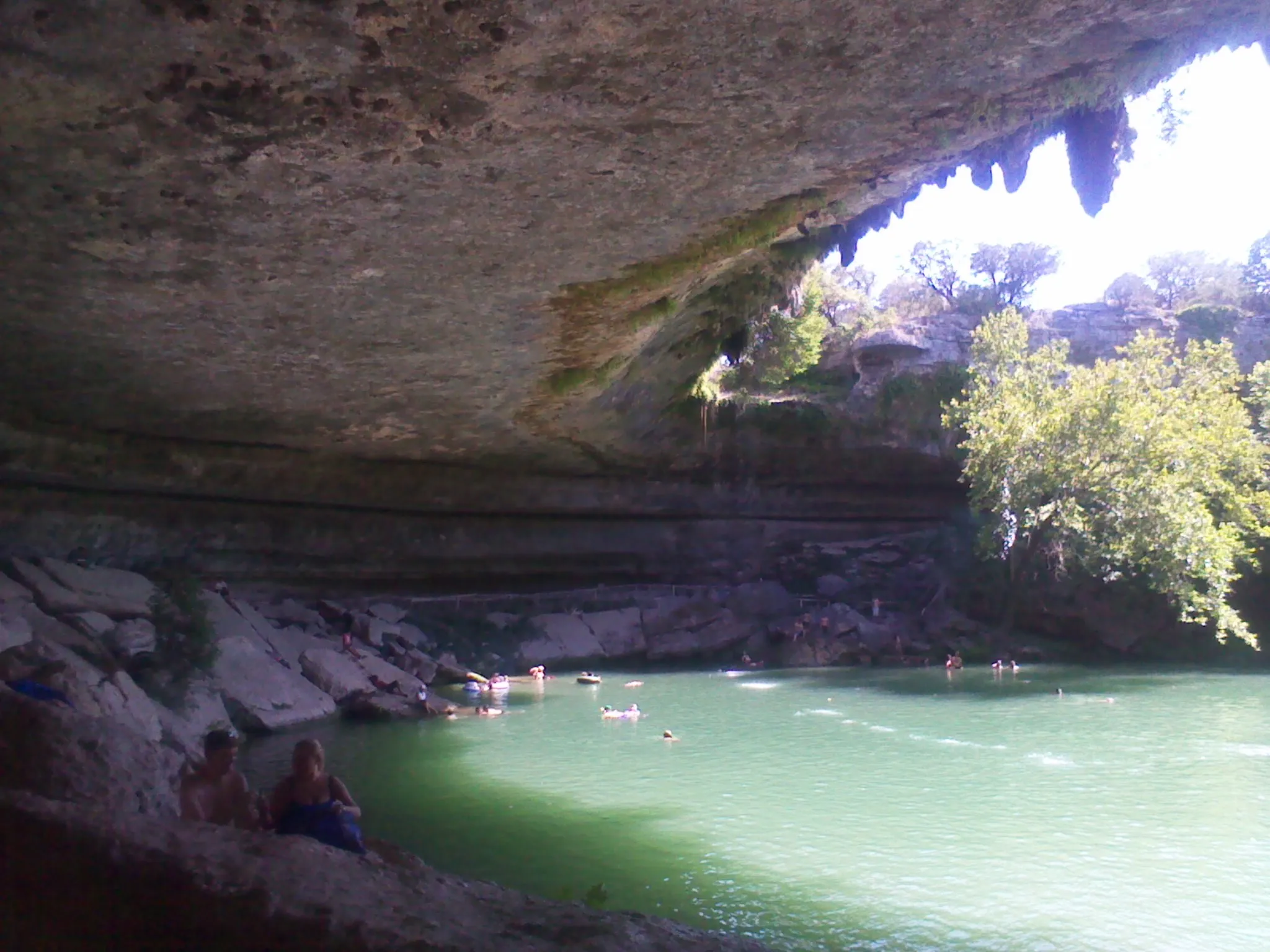 The collapsed limestone dome and jade-green pool at Hamilton Pool Preserve in Travis County