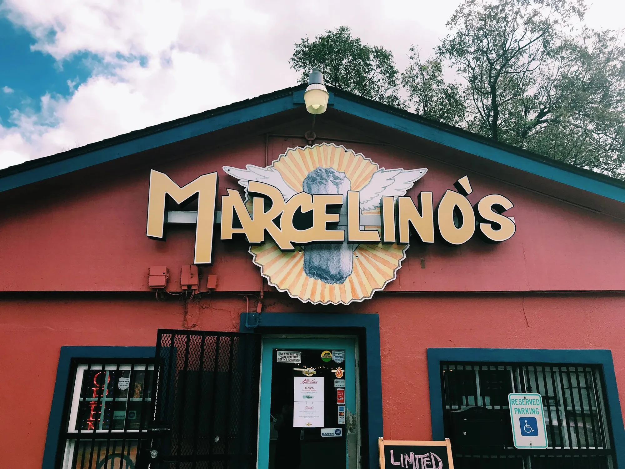 The red Marcelino's storefront in East Austin with its painted sign above the entrance