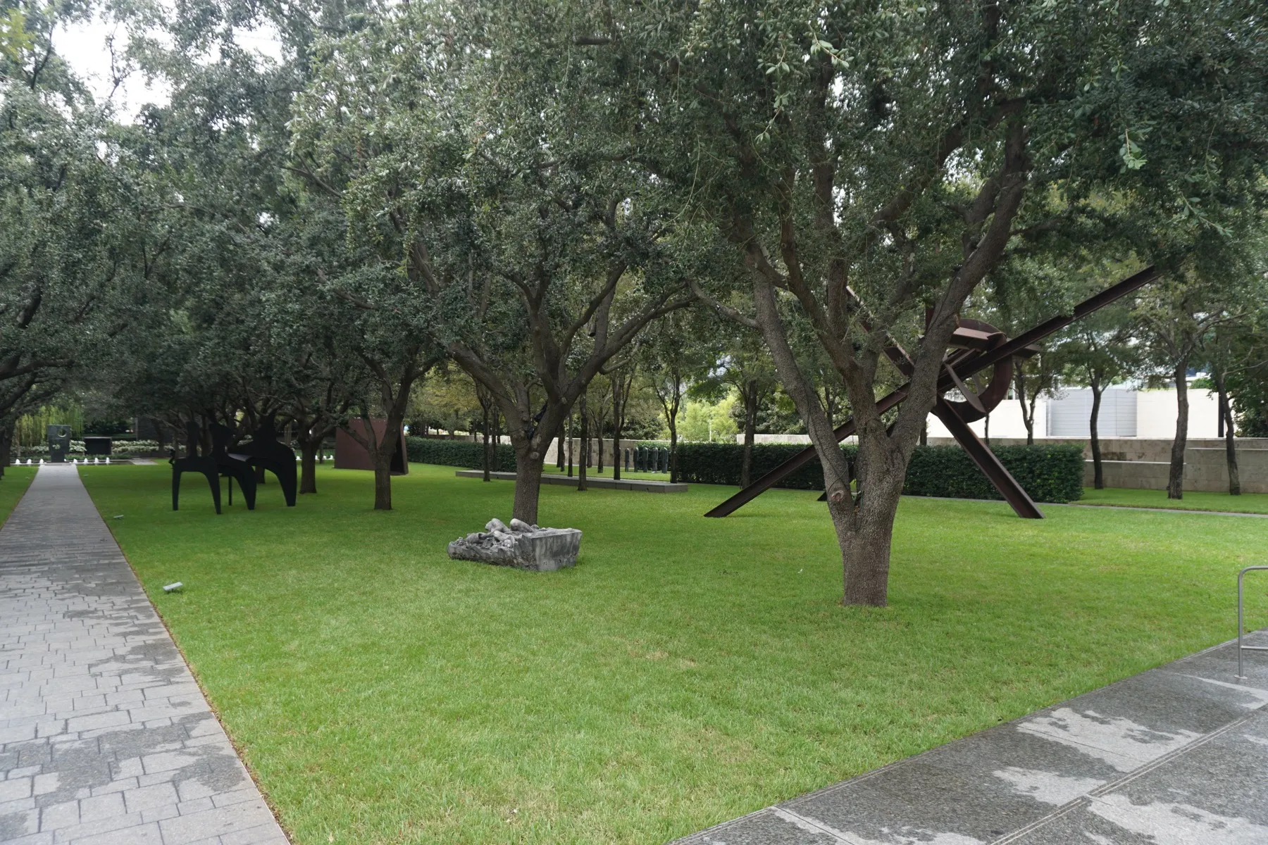 Sculptures set among trees in the garden at the Nasher Sculpture Center in Dallas