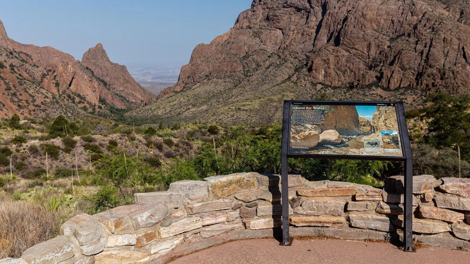 The Window rock formation framed by Chisos Basin slopes near sunset