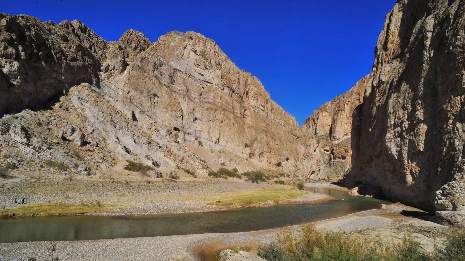 The Rio Grande curves beneath the limestone wall of Boquillas Canyon