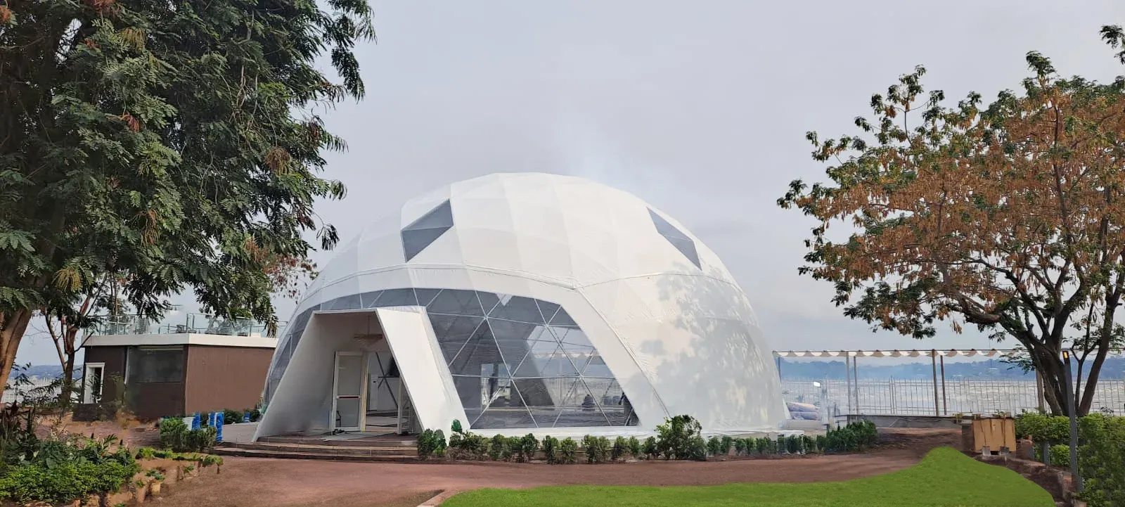 A white geodesic dome tent with a wide window