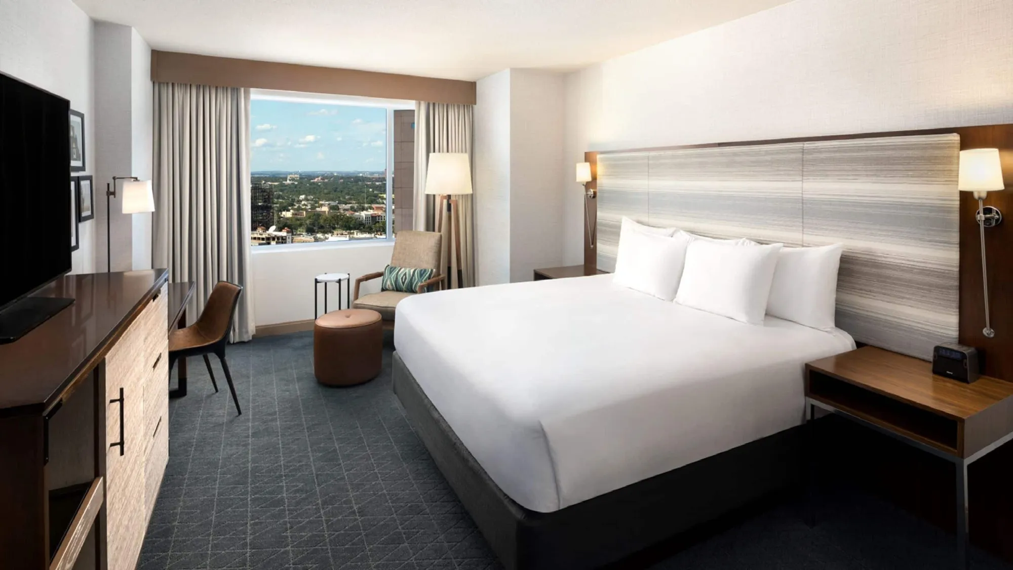 King bed and city-facing window at Grand Hyatt San Antonio