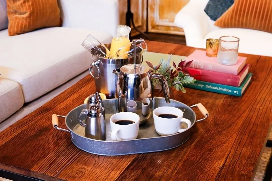 Coffee and breakfast set on a tray in a Hoffman Haus guest room