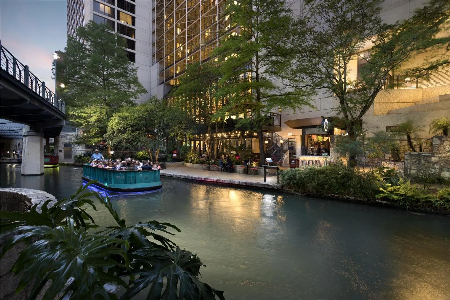 River Walk boat beside Hyatt Regency San Antonio