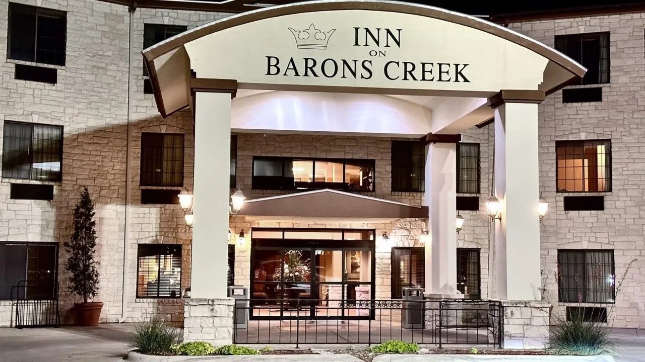Inn on Barons Creek sign above the hotel entrance in Fredericksburg