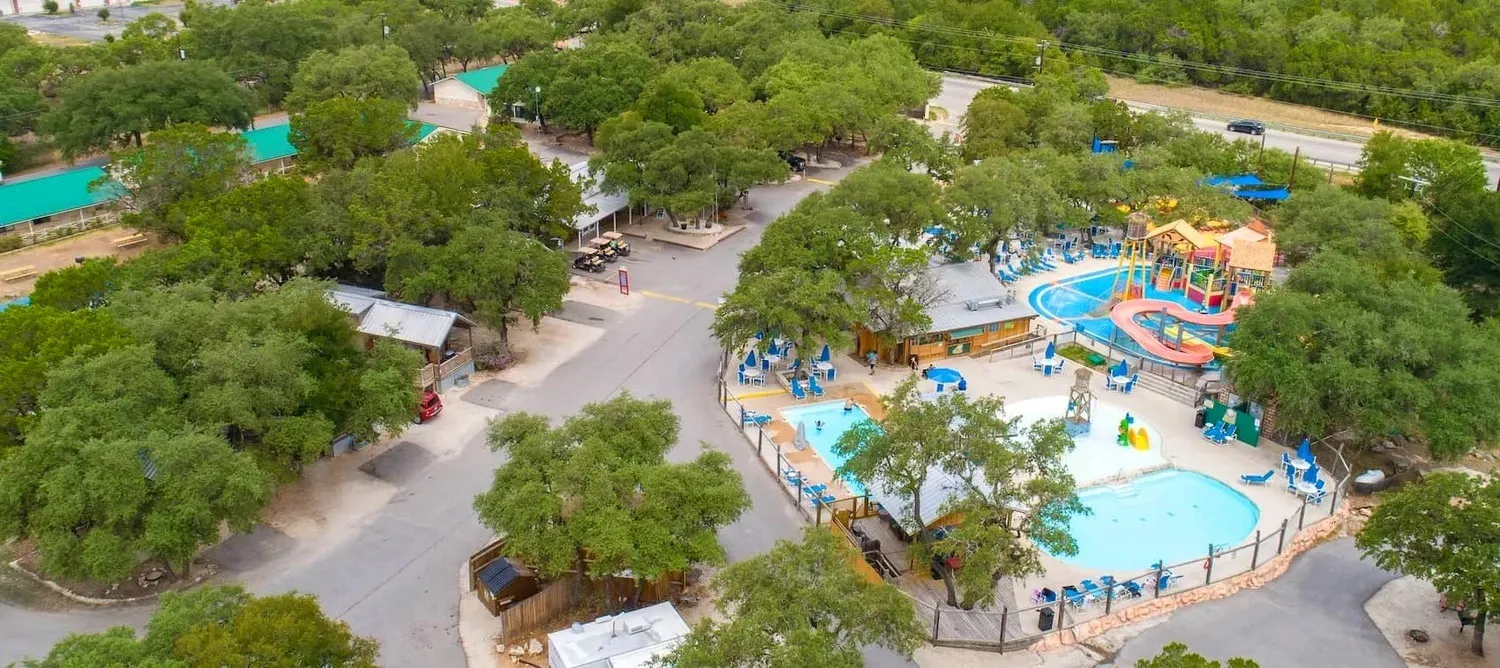 Aerial view of pools and waterslides at Jellystone Park Canyon Lake