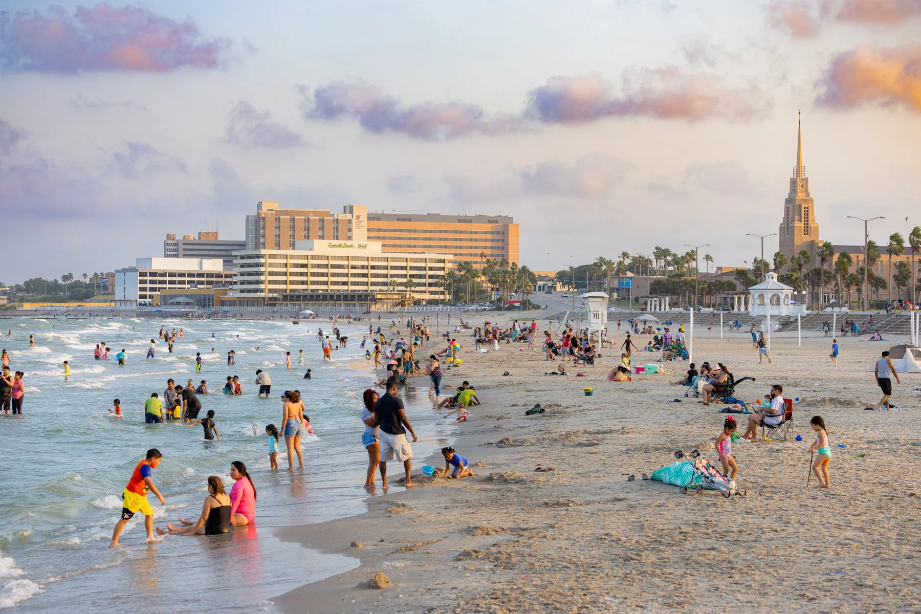 Families playing beside Corpus Christi Bay at McGee Beach