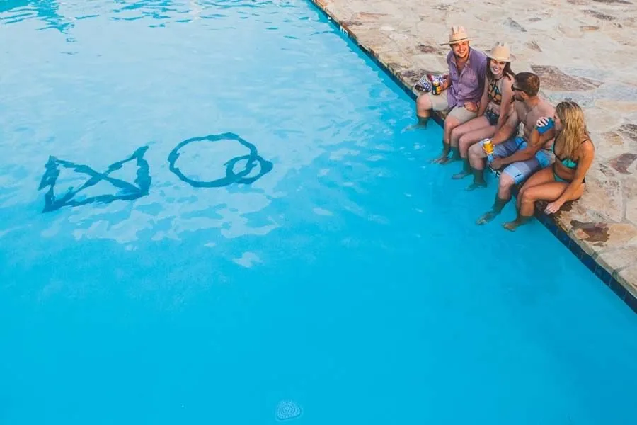 Guests sitting beside the shared pool at Mystic Quarry