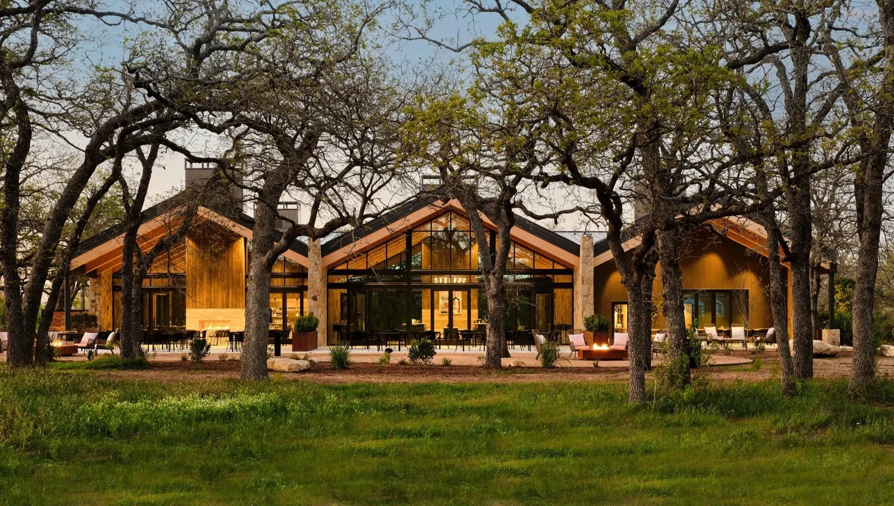 The Texas tasting room at Halter Ranch beneath mature oaks