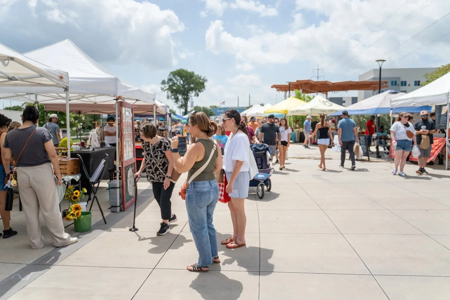 Shoppers among the outdoor tents at the Waco Downtown Farmers Market