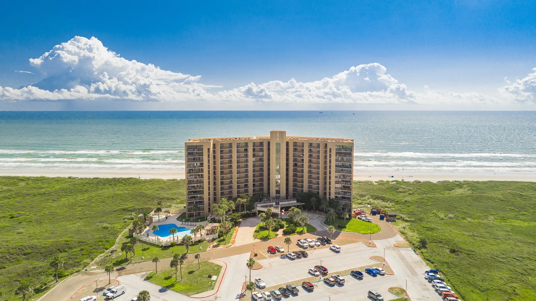 Sandpiper Condominiums between the road and the Gulf beach