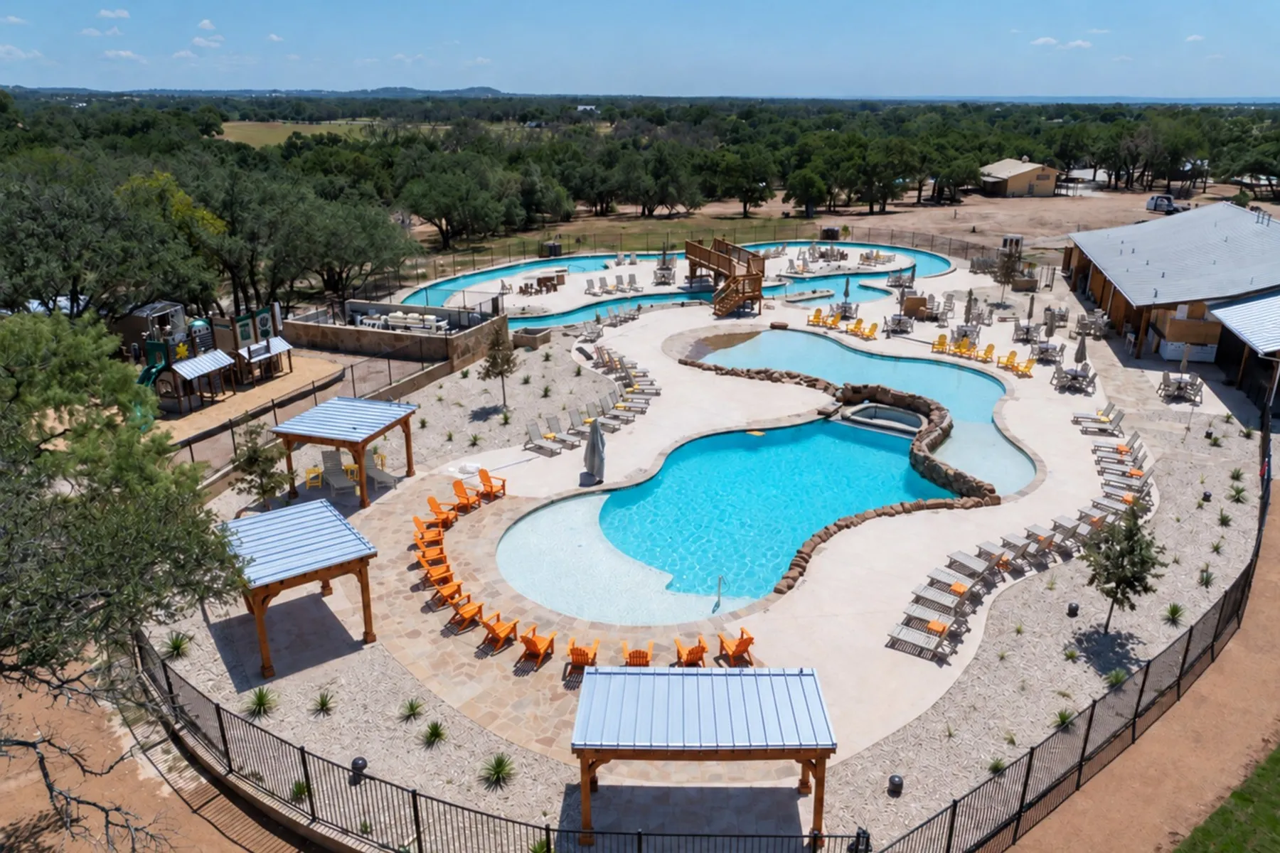 Pools and lounge chairs at the Fredericksburg Texas KOA Resort