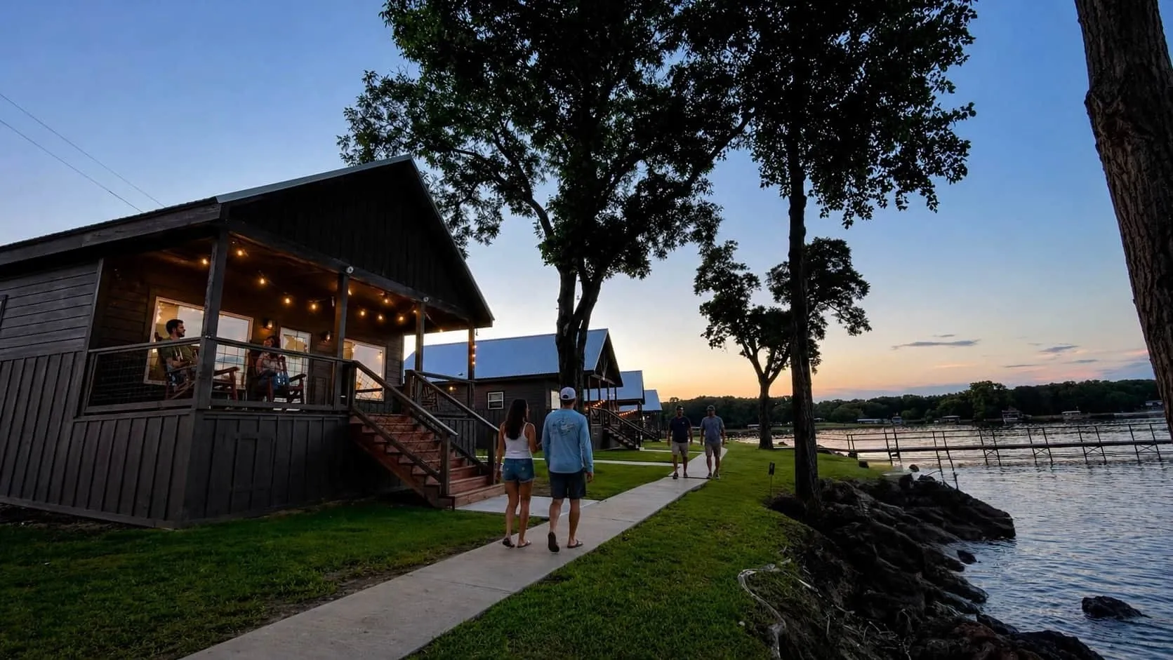 Open Water Lodge cabin porch beside Lake Tawakoni at sunset