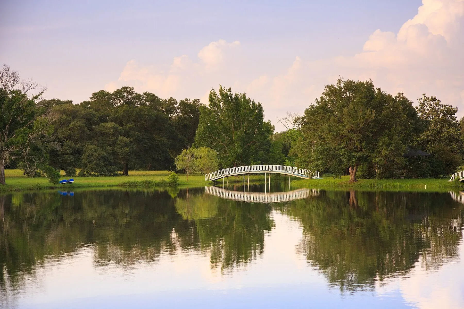 BlissWood ranch lake and footbridge in Cat Spring