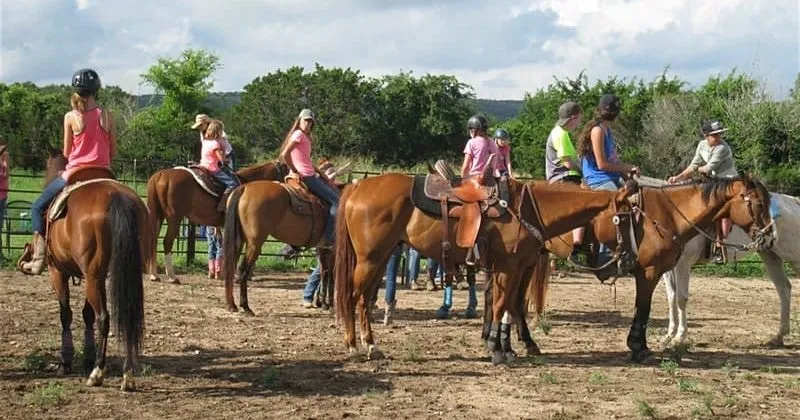 Guests on horses with a guide at Rancho Cortez