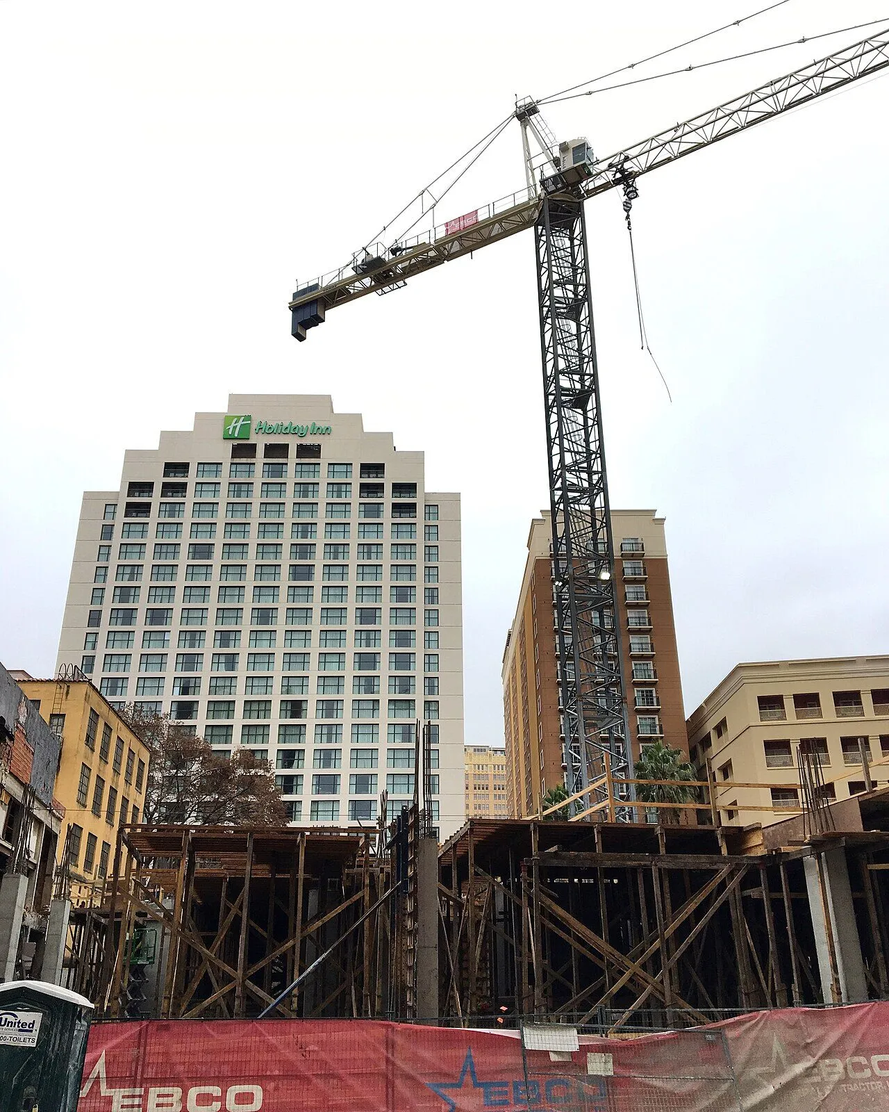 The Holiday Inn San Antonio Riverwalk tower rising above the downtown river corridor