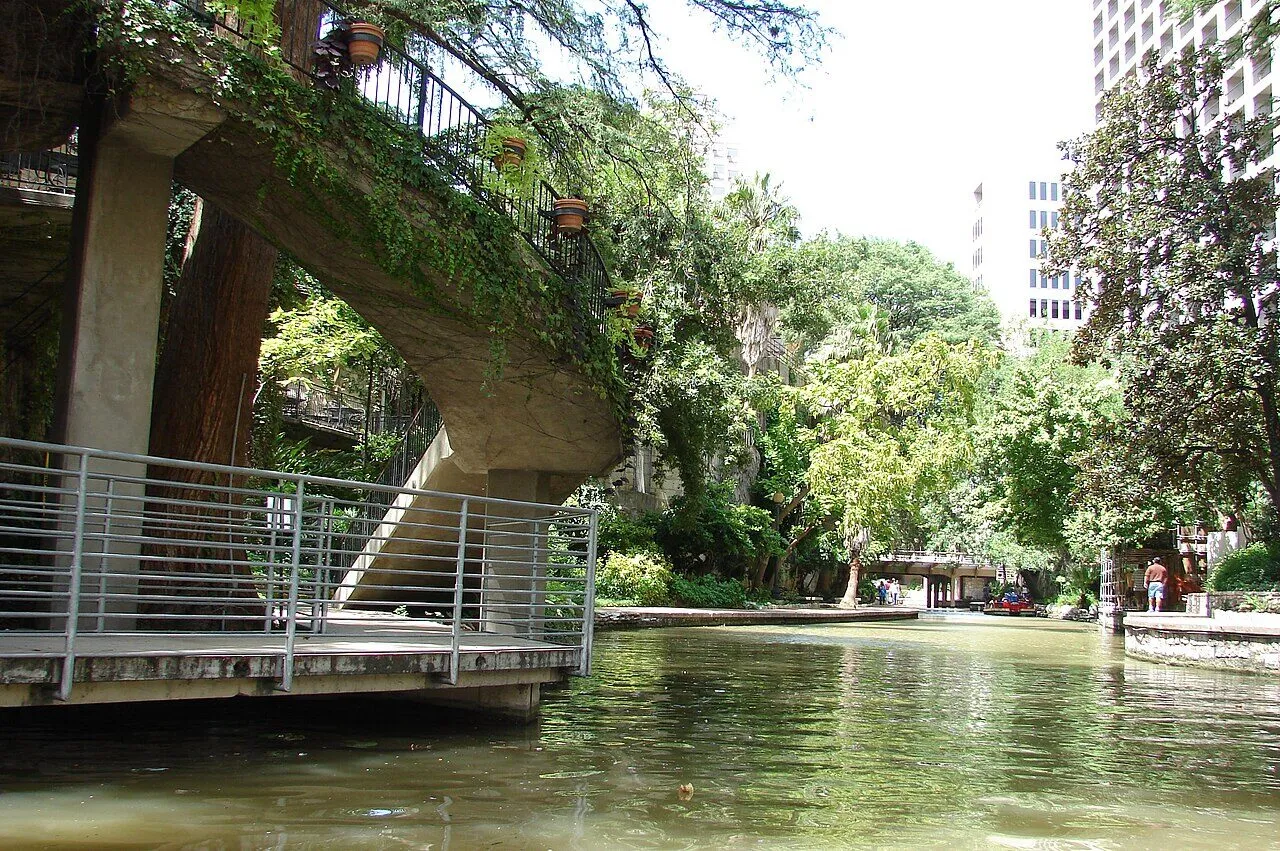A shaded footbridge crossing the central San Antonio River Walk