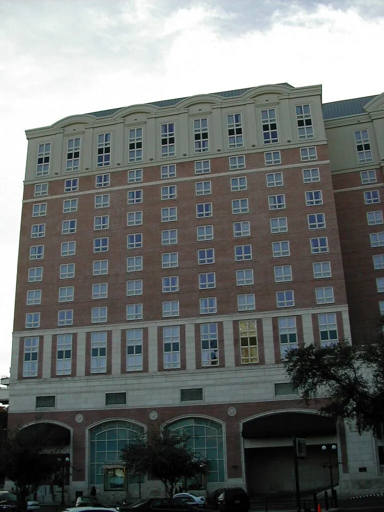 The pale stone east wing of The Westin Riverwalk in downtown San Antonio