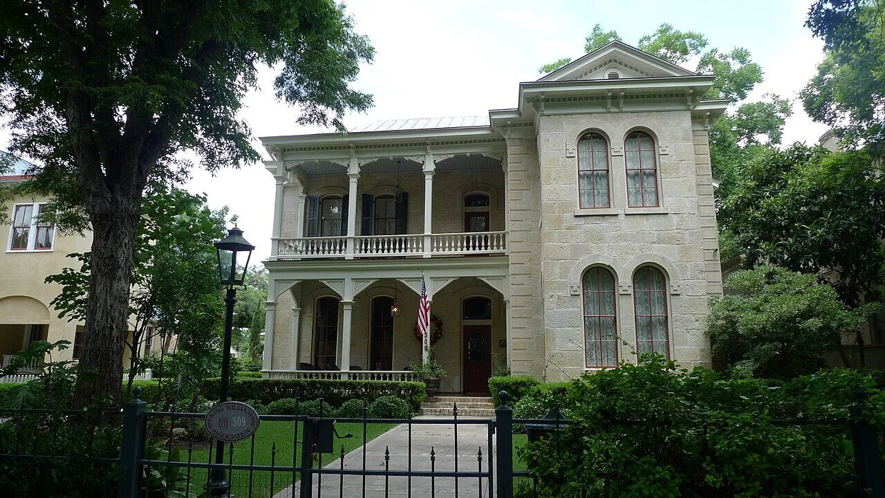 A two-story historic house with deep porches in San Antonio's King William district