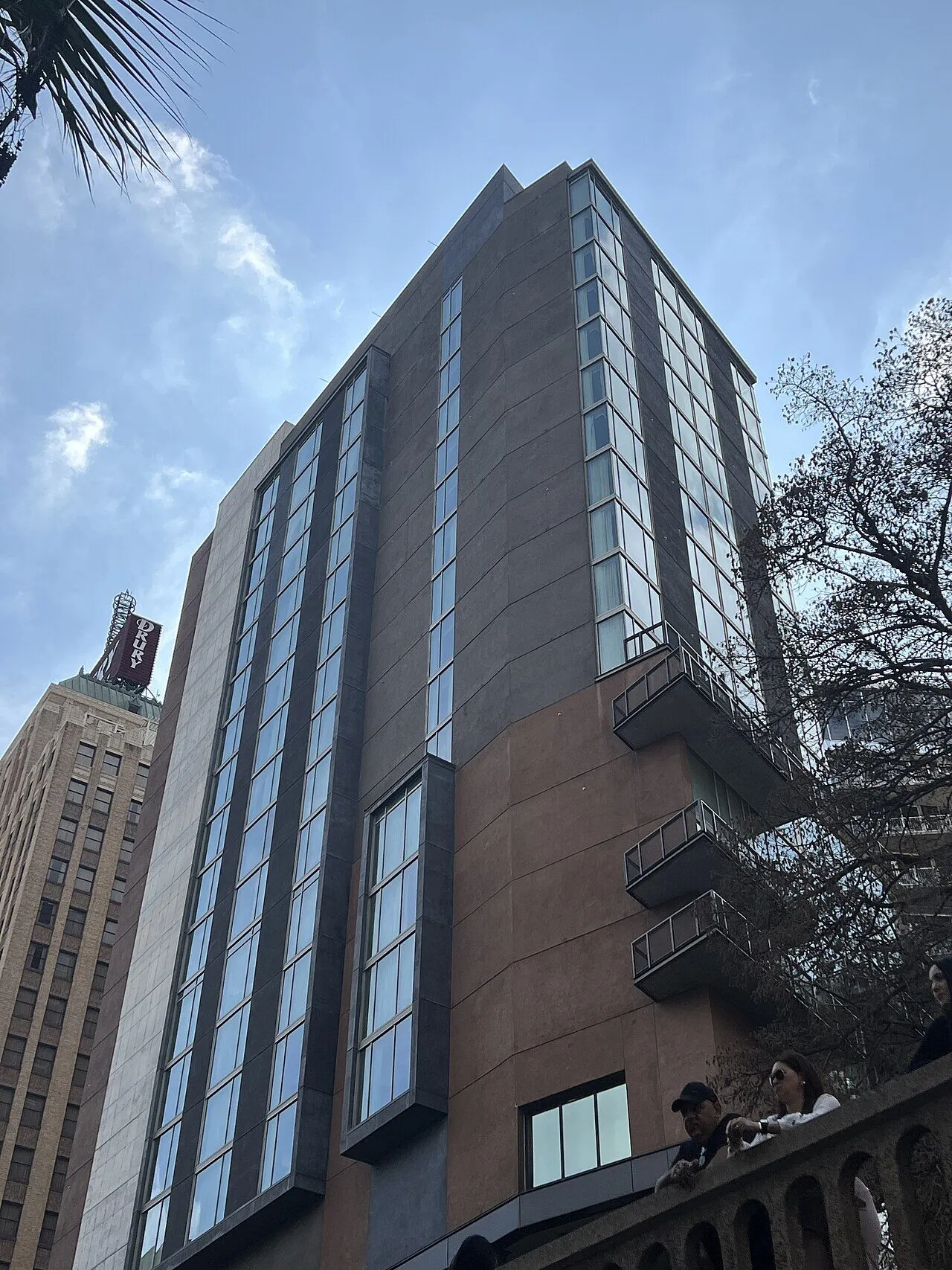 The modern Canopy by Hilton San Antonio Riverwalk tower viewed from street level