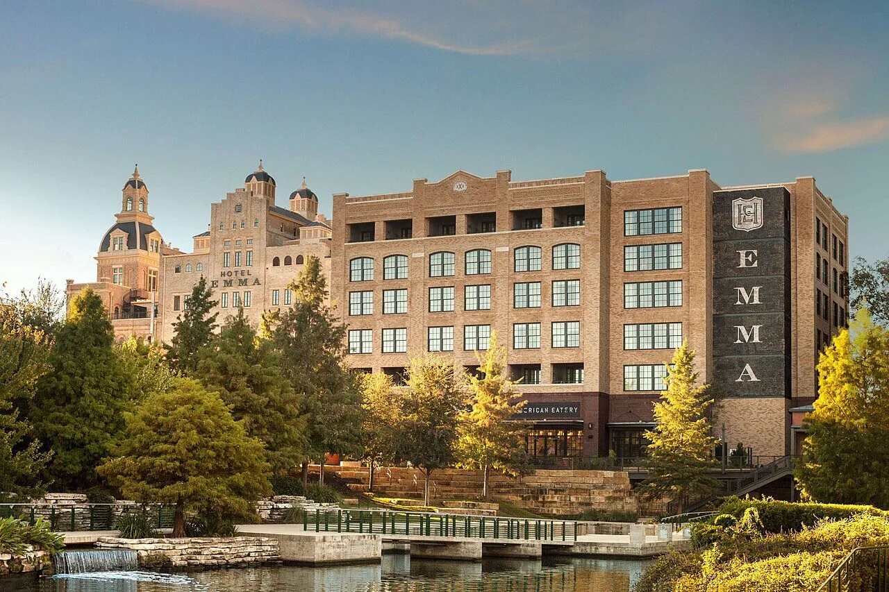 Hotel Emma's brick brewhouse exterior beside the San Antonio River at Pearl
