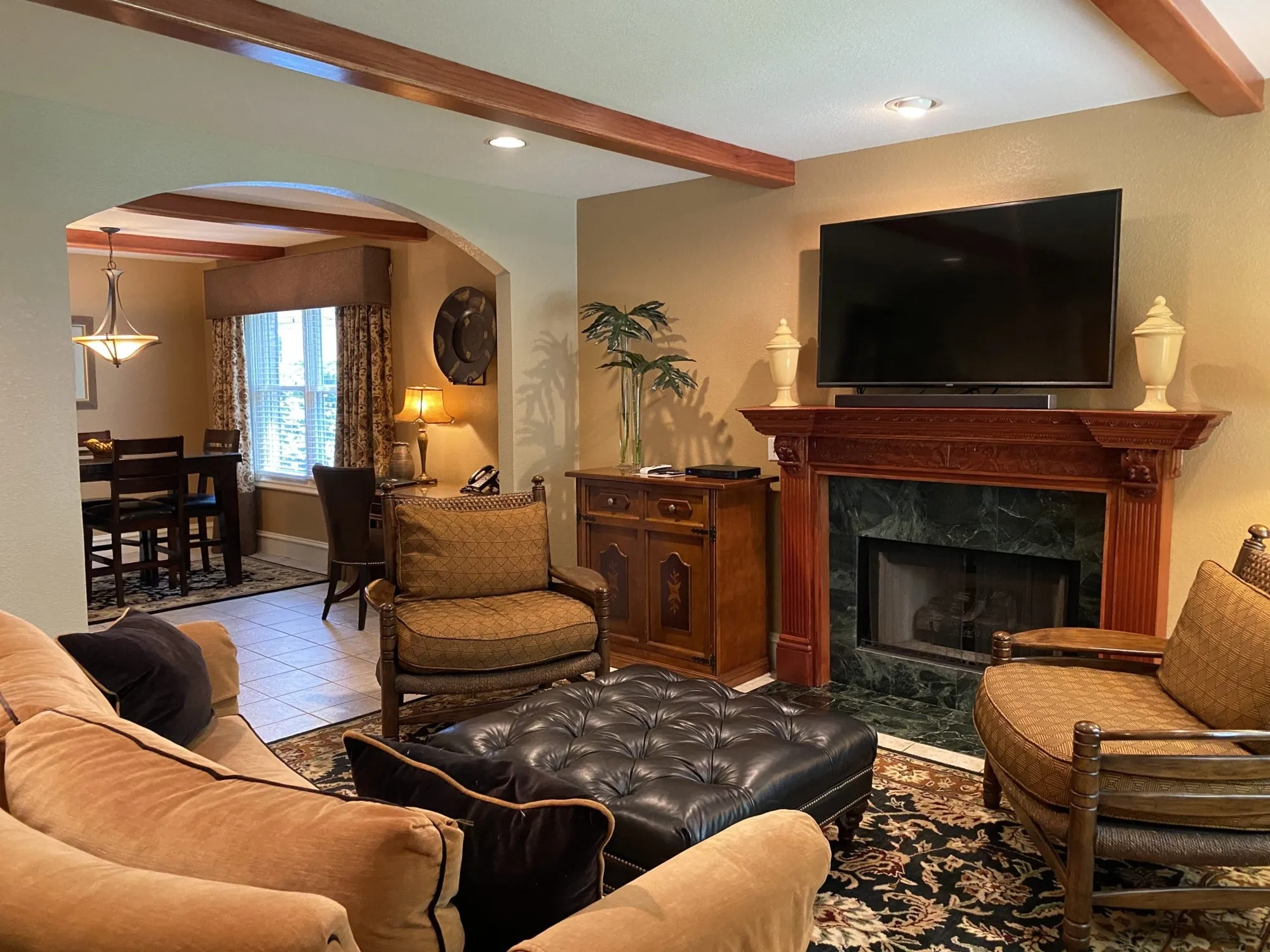 Fireplace and upholstered seating in The Sanford House lounge