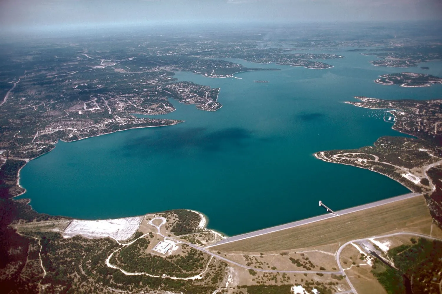 Aerial view of Canyon Lake and its dam in Comal County