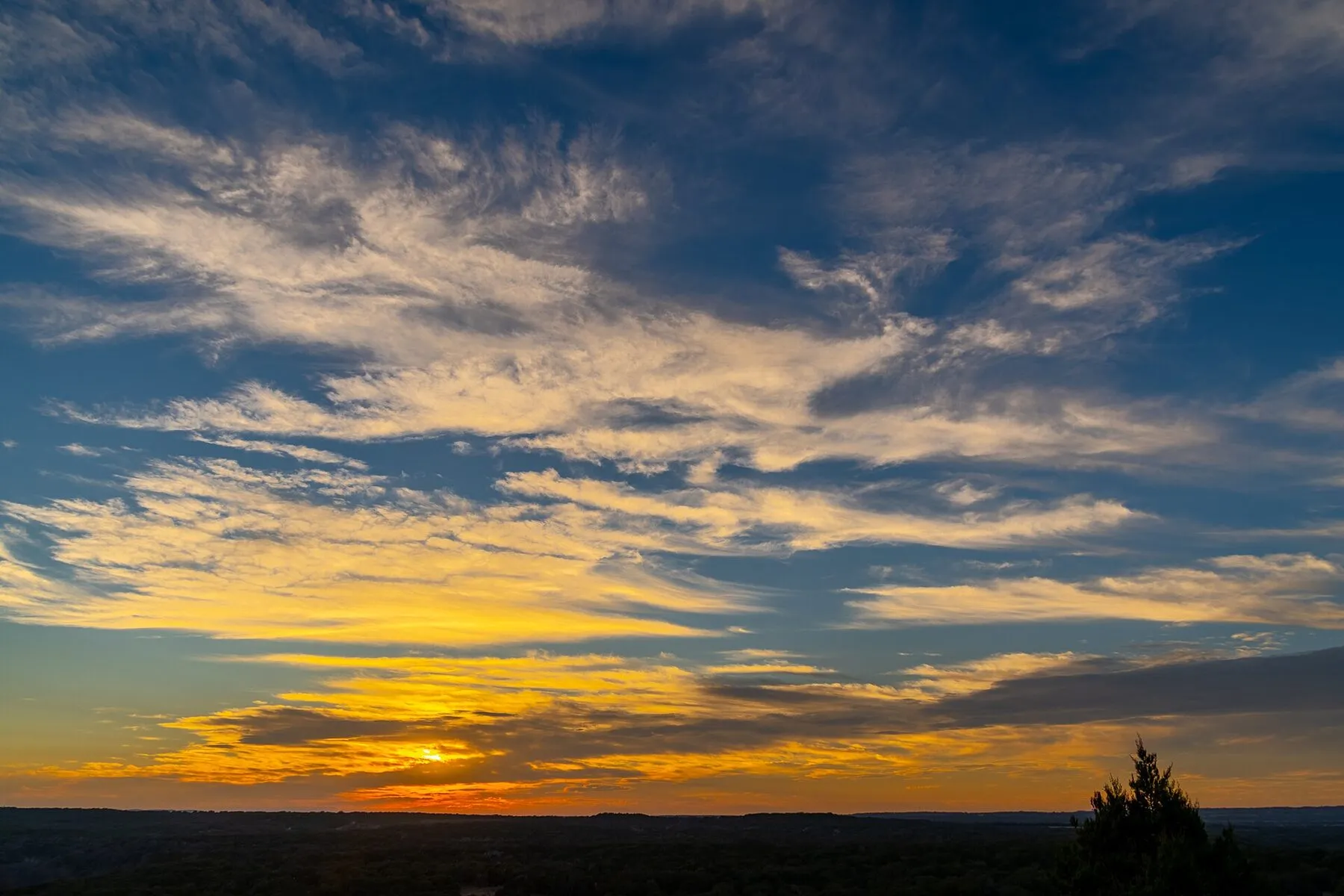 Sunset over the wooded hills at Pedernales Falls State Park