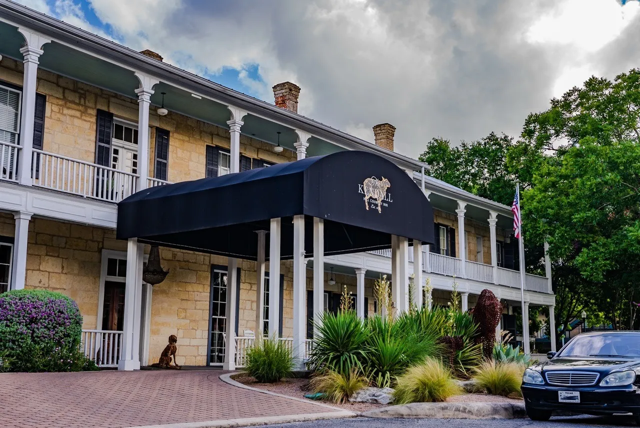 White porches and entrance canopy at The Kendall in Boerne