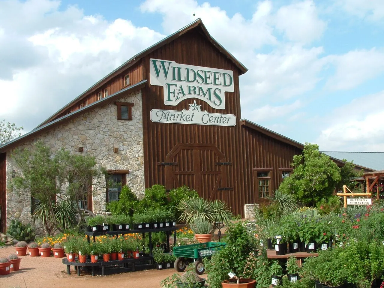 Wildseed Farms Market Center with potted plants arranged outside