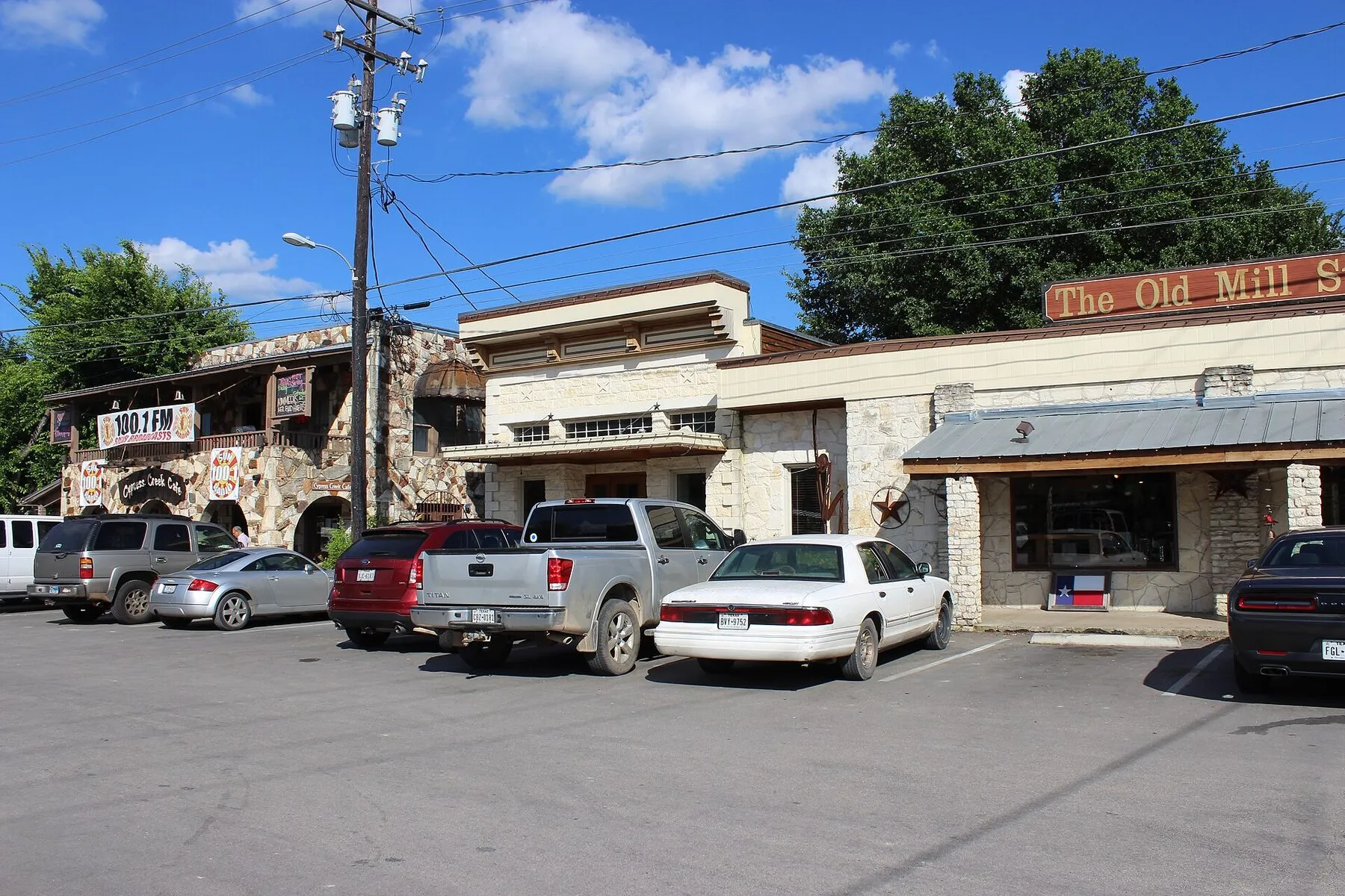 Shops and pedestrians along a street in downtown Wimberley