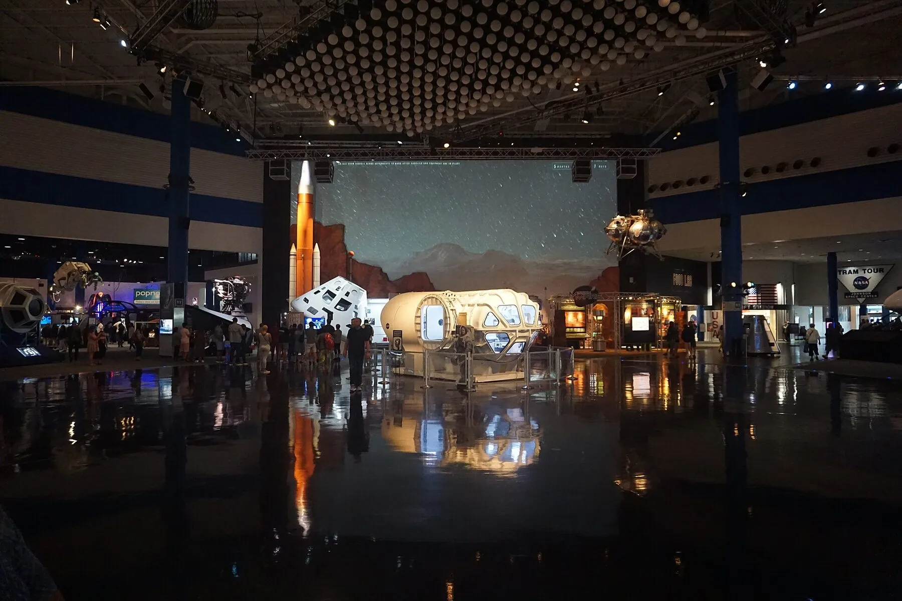 Visitors and spacecraft exhibits inside Space Center Houston